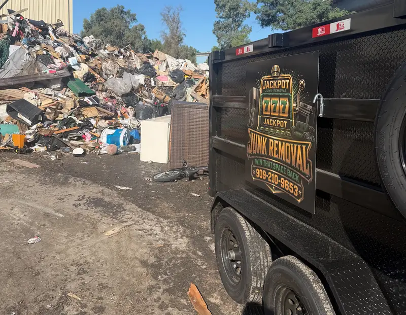 Jackpot Junk Removal trailer unloading at the disposal site